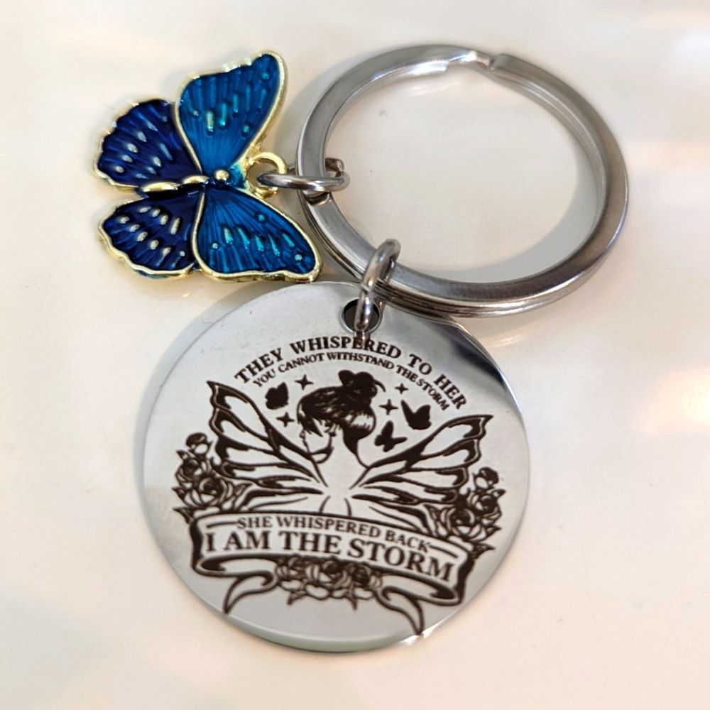 NWT butterfly " I am the storm" keychain -2-3/8"L from end 2 end Butterfly .75x1